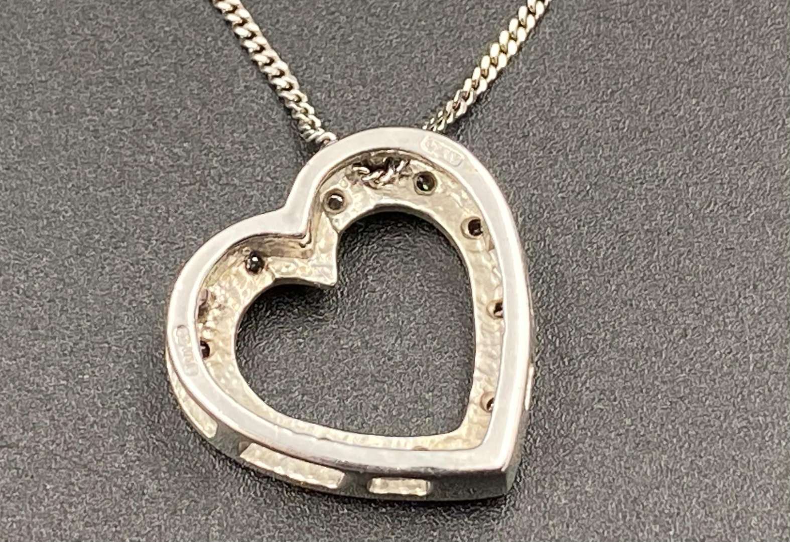 <p>A diamond set 9ct white gold, heart shaped pendent.</p>