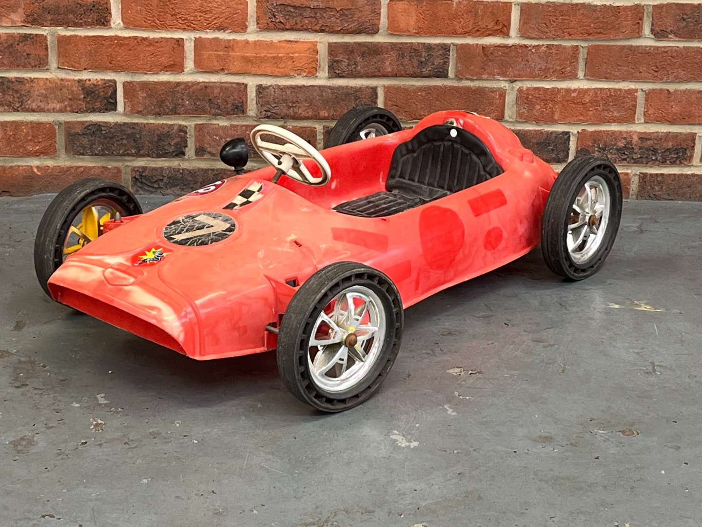 <p>Tri-Ang Plastic F1 Pedal Car</p>