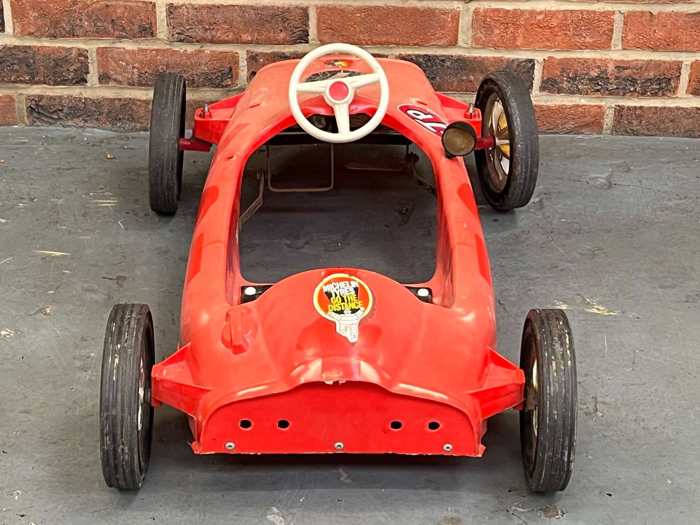 <p>Tri-Ang Plastic F1 Pedal Car</p>