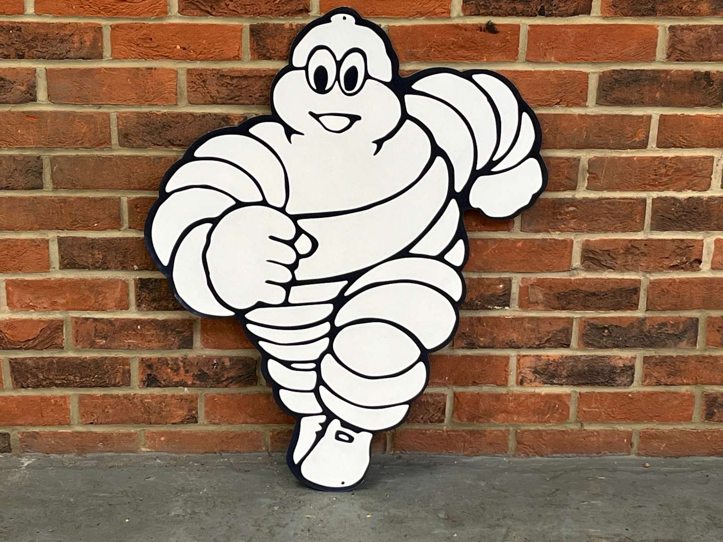 <p>Michelin Metal Running Man Sign</p>