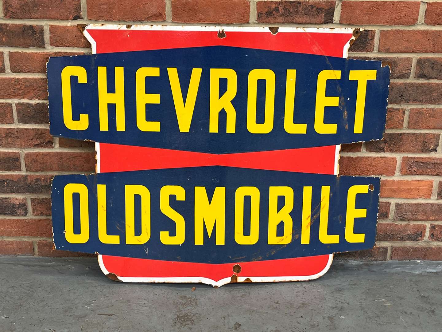 <p>Chevrolet/Oldsmobile Enamel Shield Sign</p>