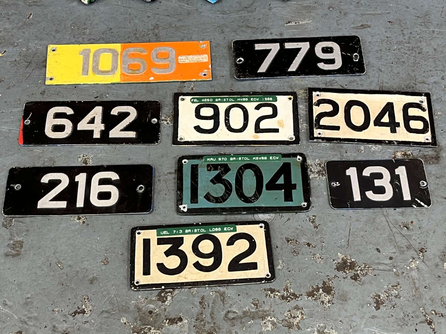 <p>Four Model Buses and Nine Metal Bus Numbers</p>