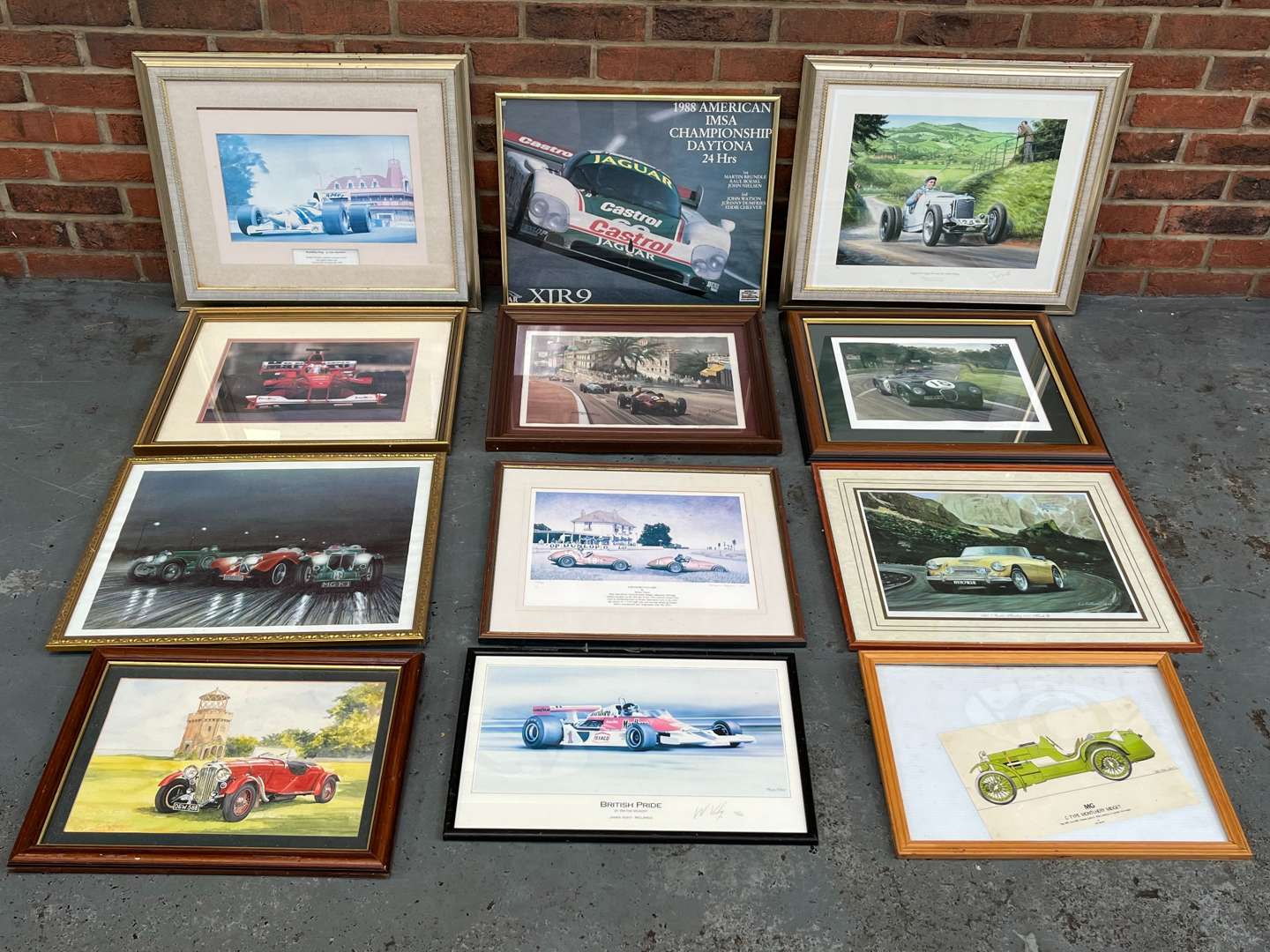 <p>Twelve Framed Motoring Prints&nbsp;</p>