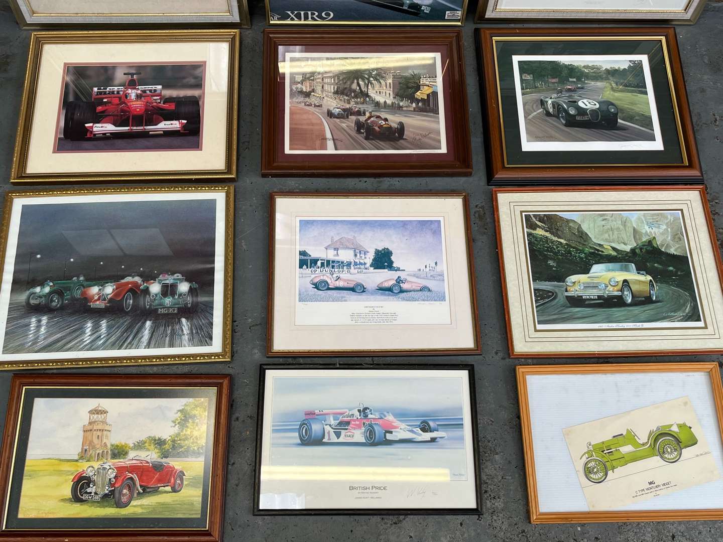 <p>Twelve Framed Motoring Prints&nbsp;</p>