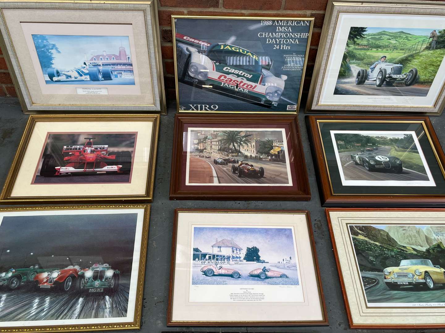 <p>Twelve Framed Motoring Prints&nbsp;</p>