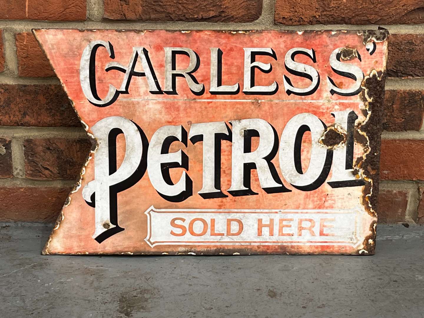 <p>Carless Petrol Sold Here Enamel Flange Sign</p>