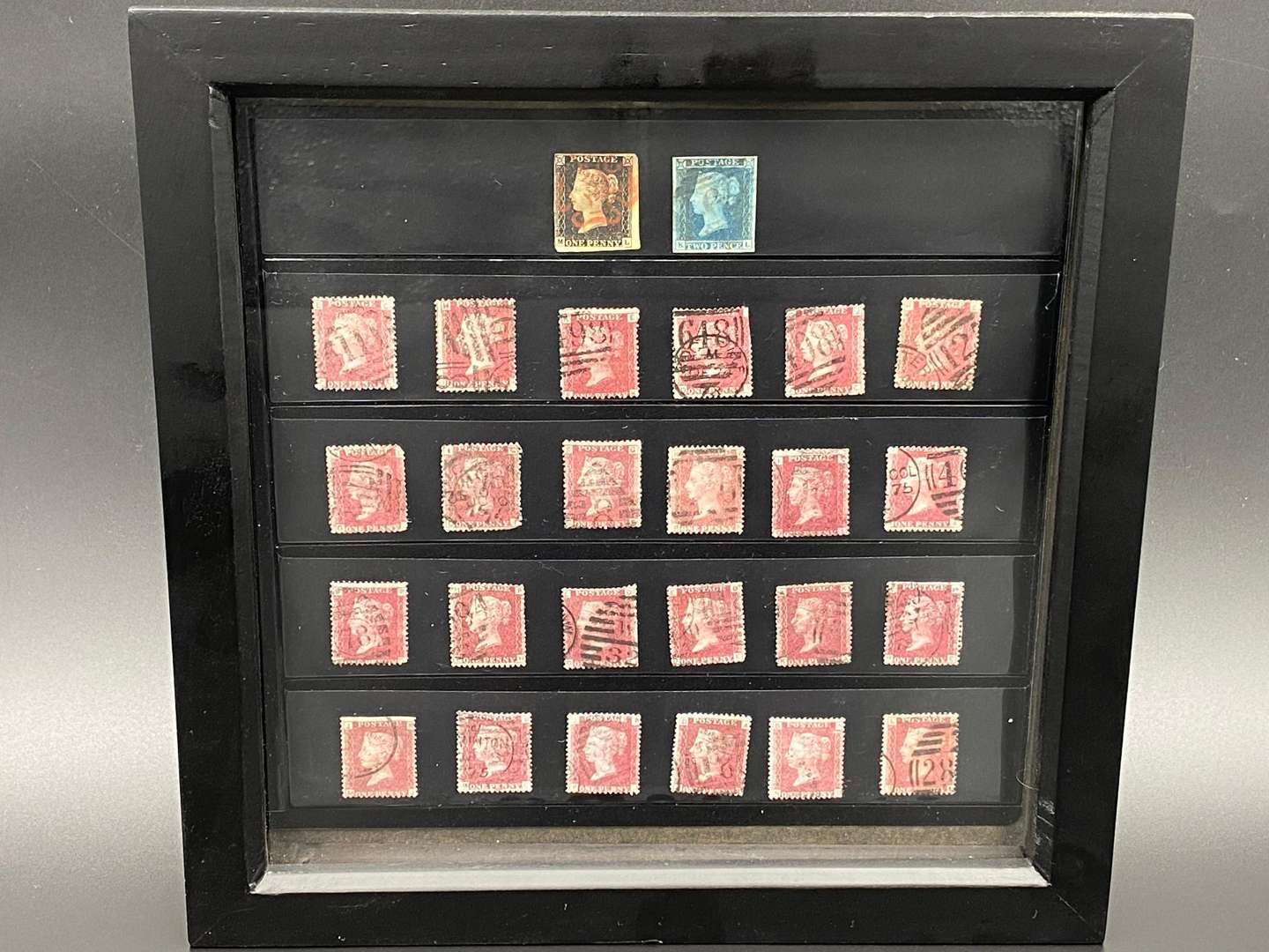 <p>A framed Victorian stamp collection</p>